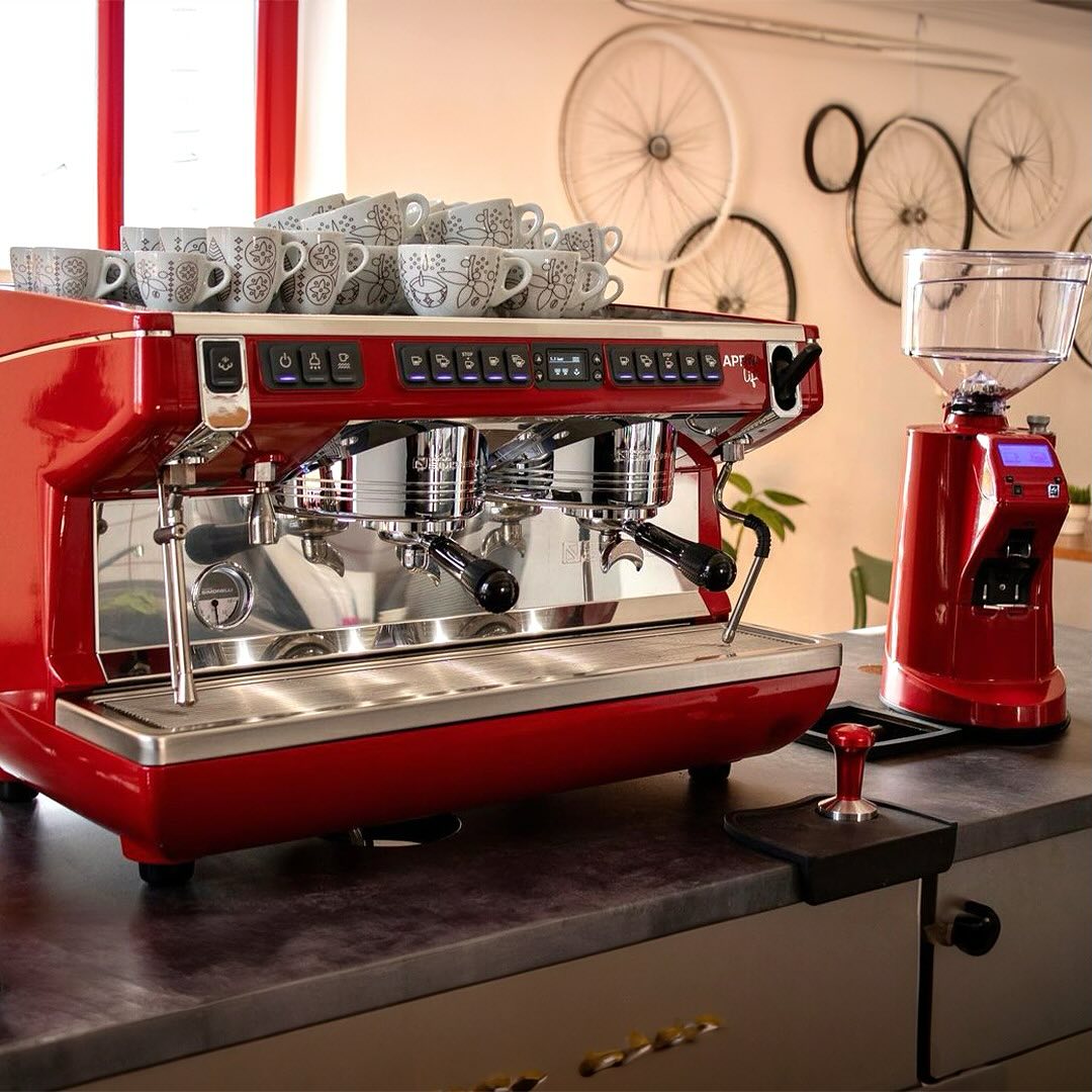 Commercial espresso machine on a café countertop, ready for brewing fresh espresso shots in a professional café setting in Malaysia.